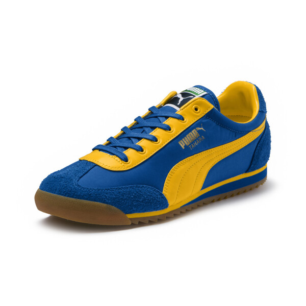 blue and yellow puma trainers