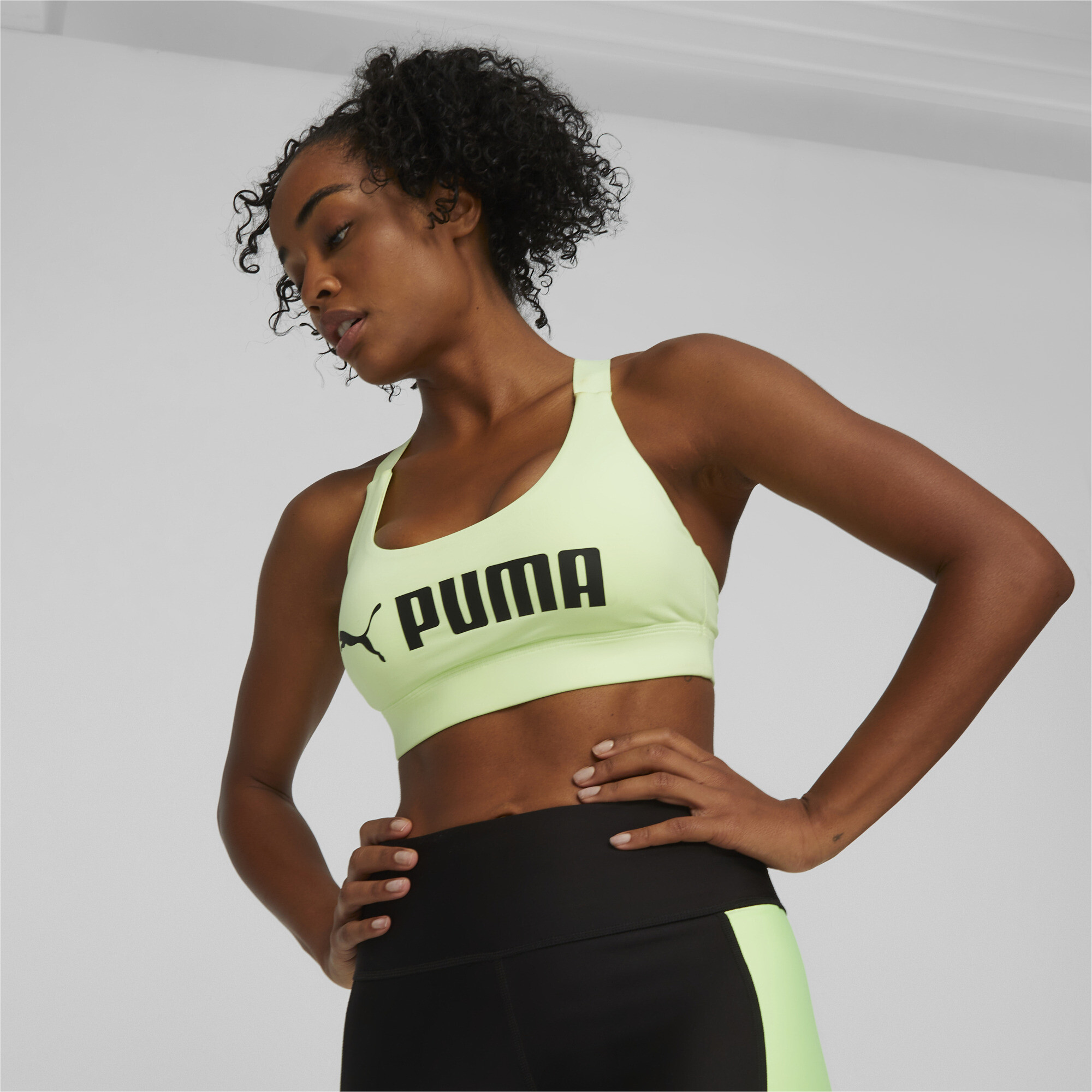 Puma Training Fit mid support sports bra in black and white