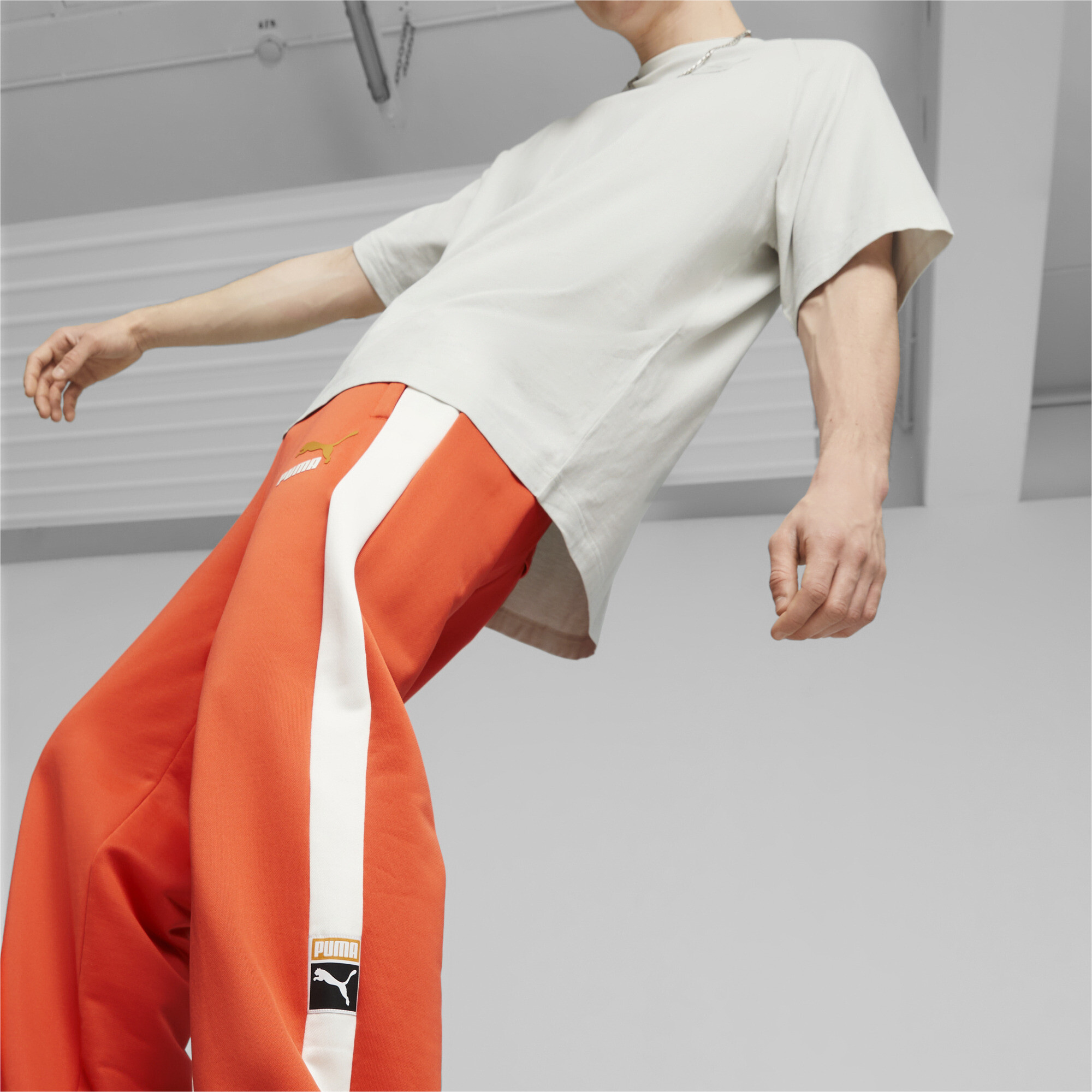 Men's PUMA T7 Track Pants In Orange, Size 2XL