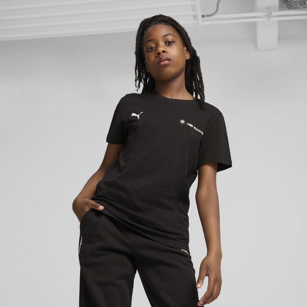 BMW M Motorsport ESS+ Logo T-Shirt Youth in Black by PUMA, 7-8Y