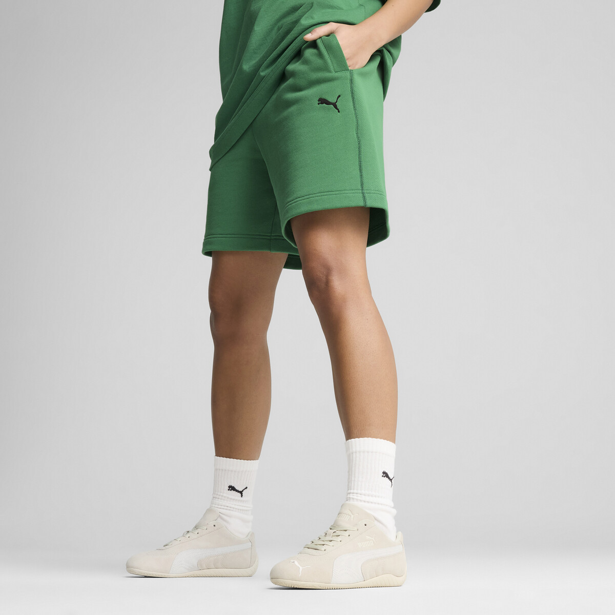 "Premium Essentials Relaxed Graphic Shorts 7"" Unisex in Archive Green by PUMA, Medium"