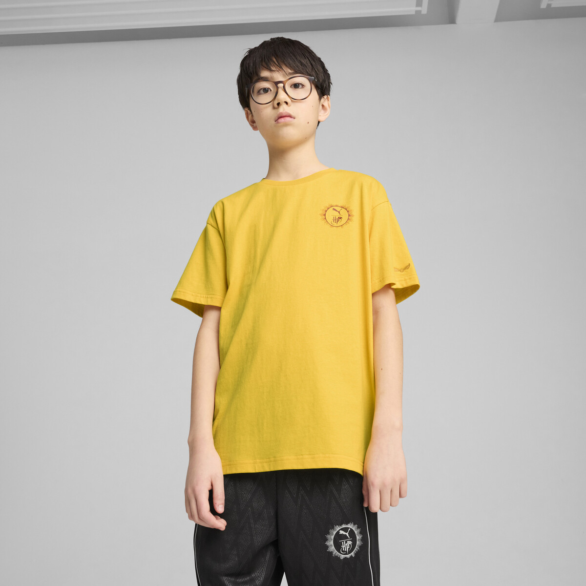PUMA x HARRY POTTER Relaxed Graphic T-Shirt Youth in Yellow Sizzle, 9-10Y