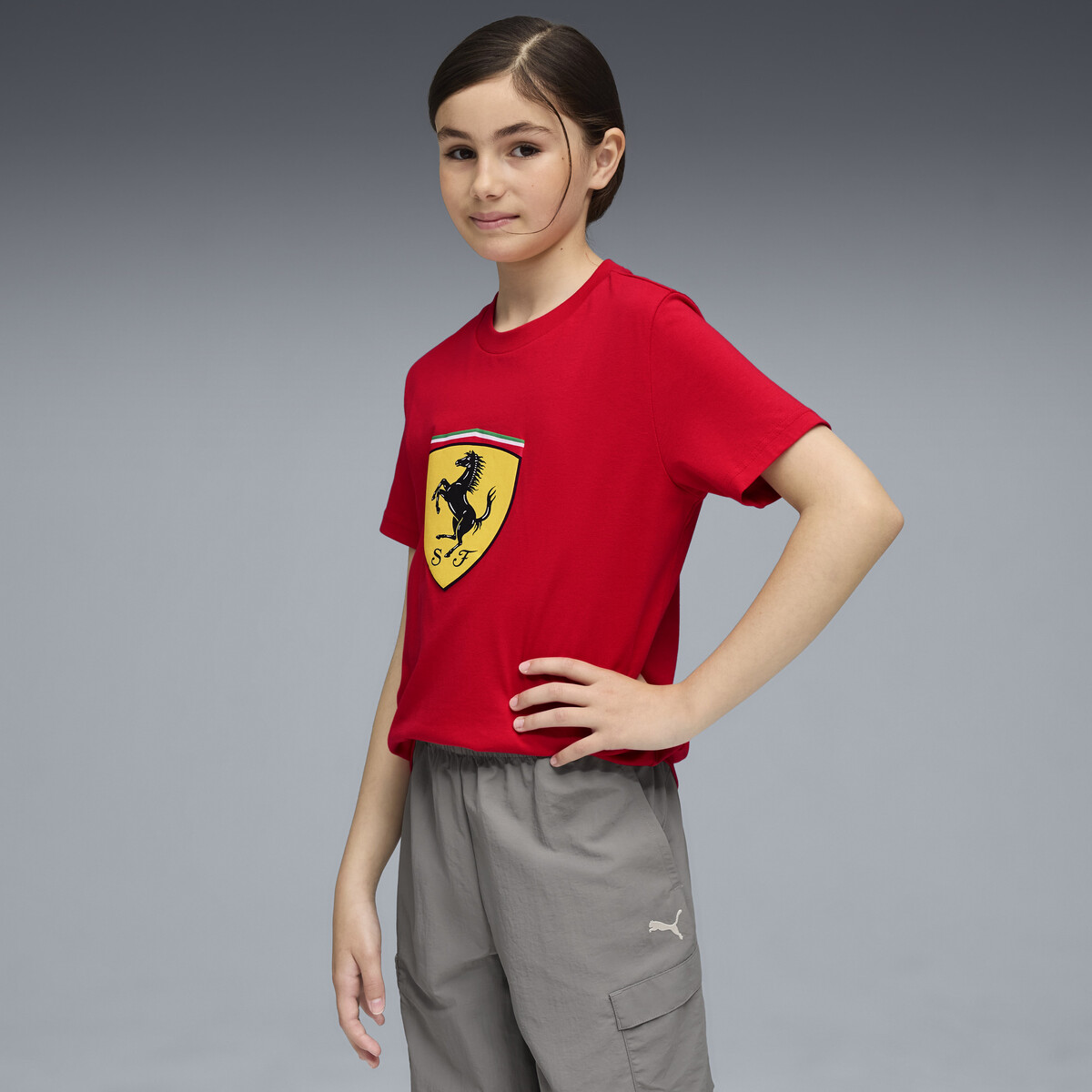 Scuderia Ferrari Sportswear Coloured Big Shield T-Shirt Youth in Rosso Corsa by PUMA, 13-14Y