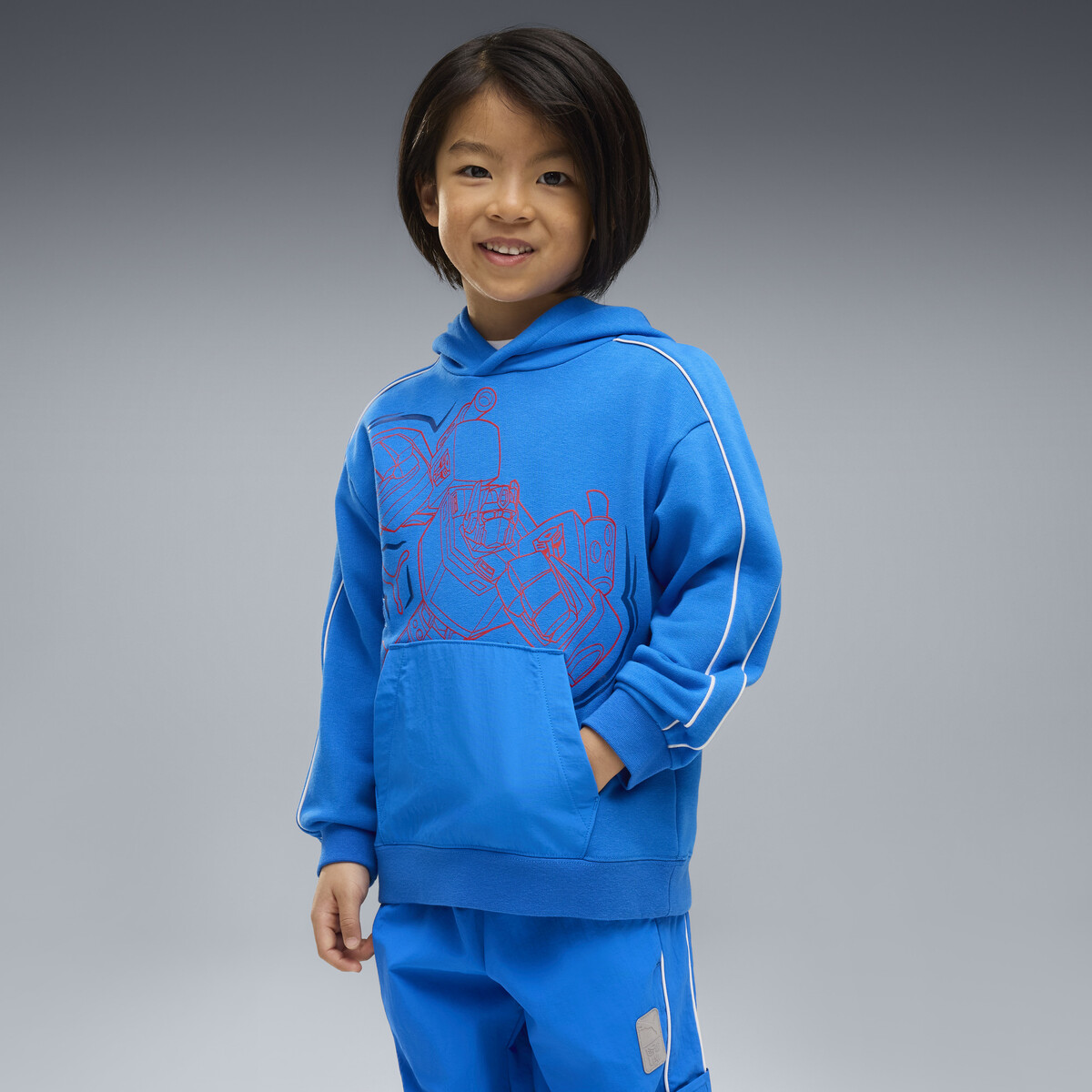 PUMA x TRANSFORMERS T7 Relaxed Graphic Hoodie Kids in Racing Blue, 6-7Y